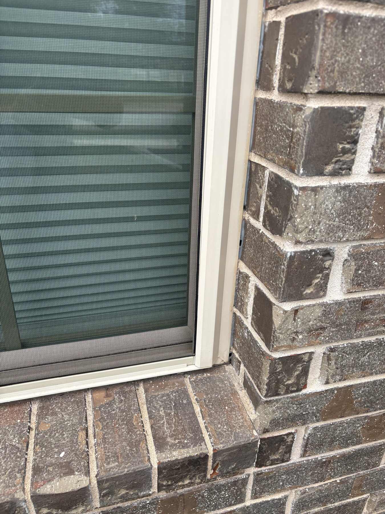 Before photo of failing sealant around a Round Rock window